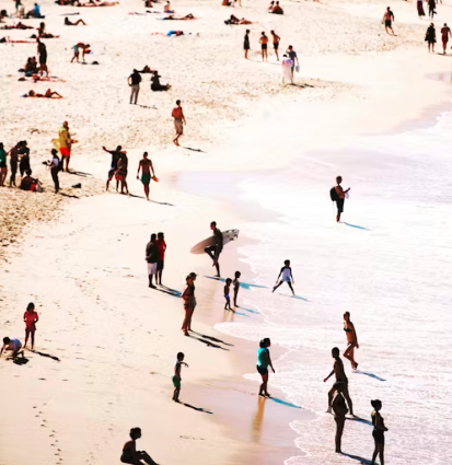 Morning crowd walking the shoreline at Bondi Beach